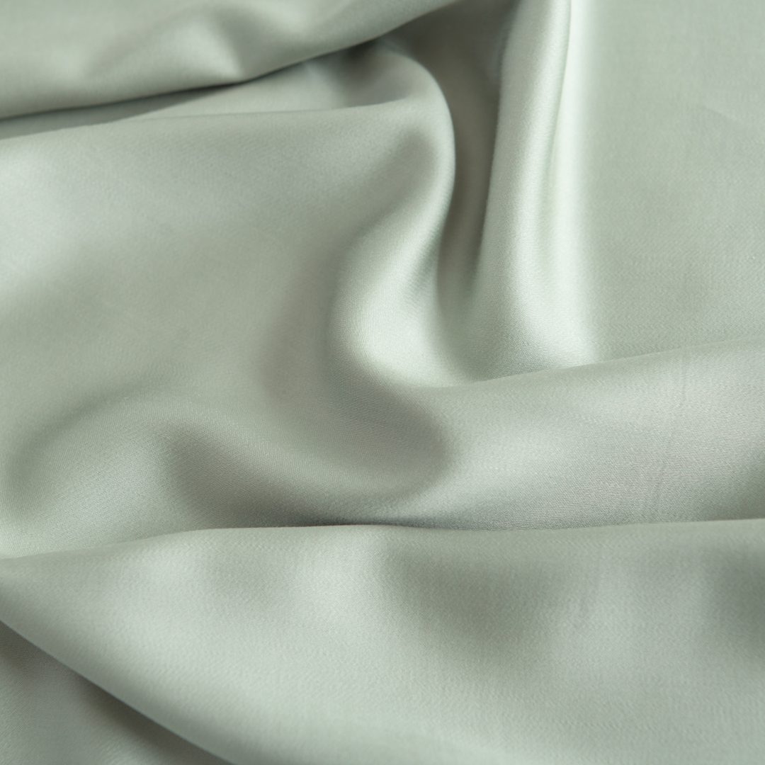 Foto van een kleurstaal bamboe beddengoed van de kleur Sage Green (kleur licht groen)