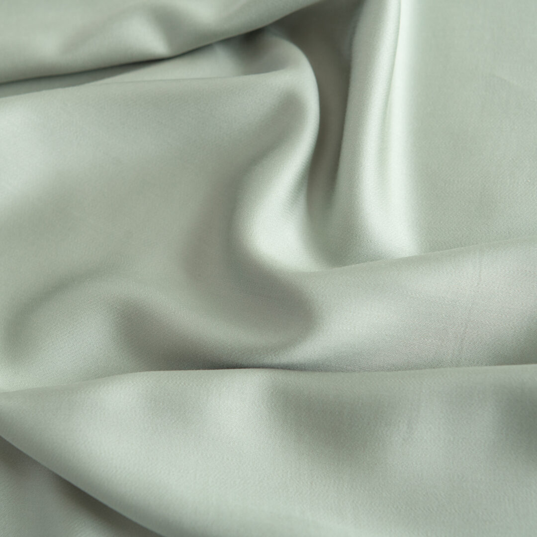 Foto van een kleurstaal bamboe beddengoed van de kleur Sage Green (kleur licht groen)
